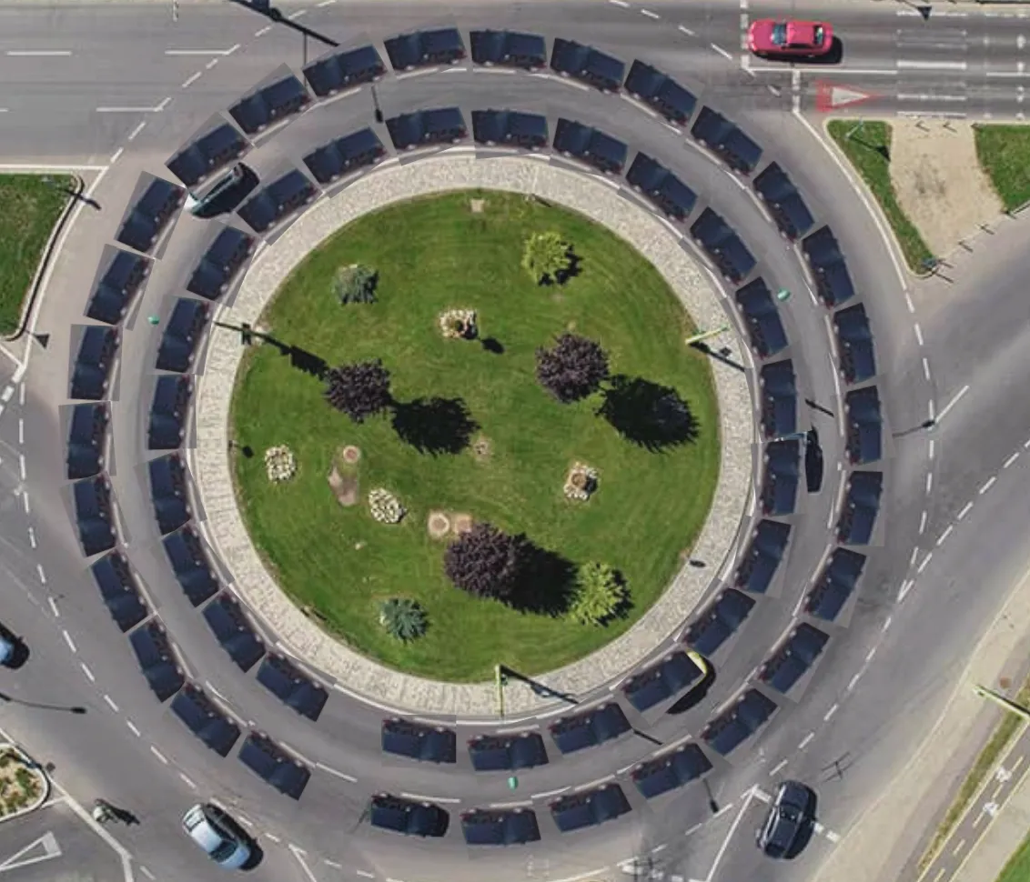 A two lane roundabout with cars almost touching each other