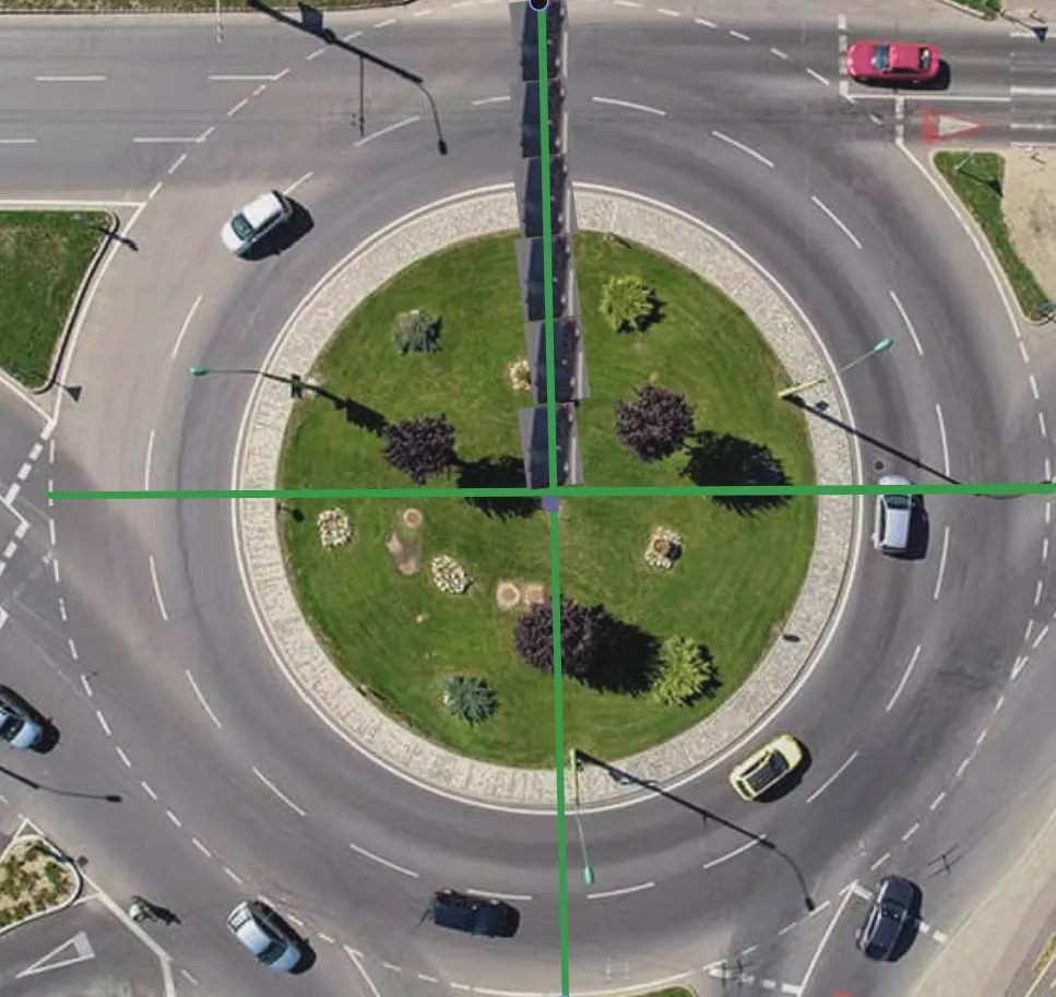 A two lane roundabout with cars laid back to back to measure the diameter